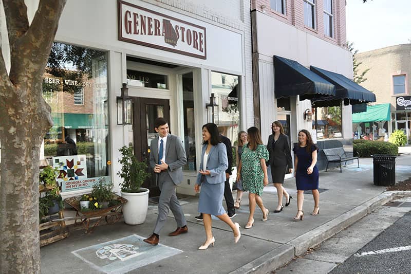 Photo of the legal team of the Bryant & O'Connor Law Firm walking outside